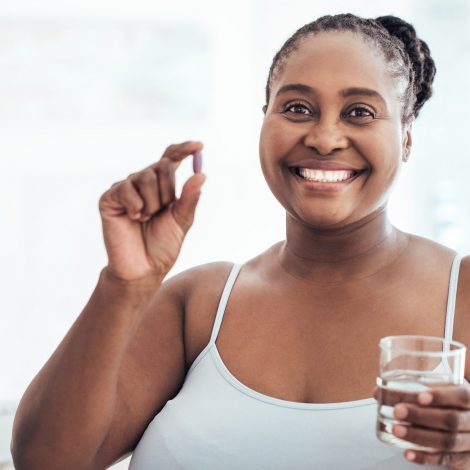 Woman with medicine and water