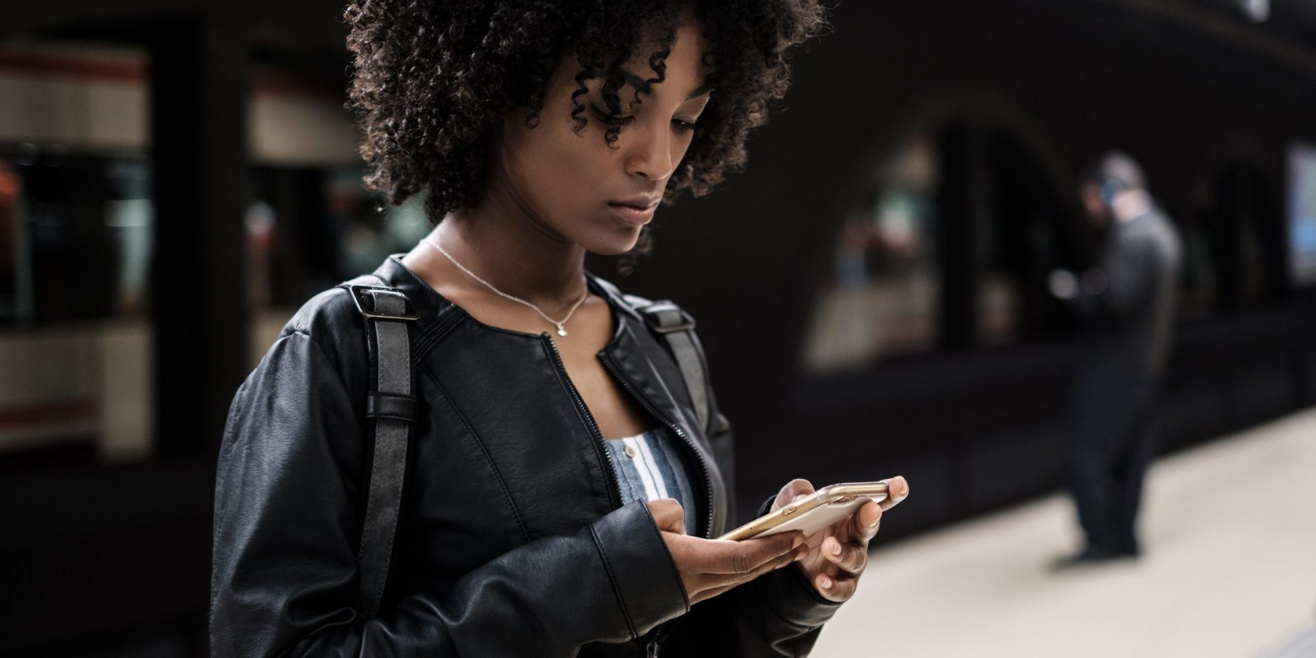 Woman in the subway holding phone