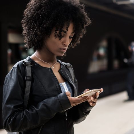 Woman in the subway holding phone