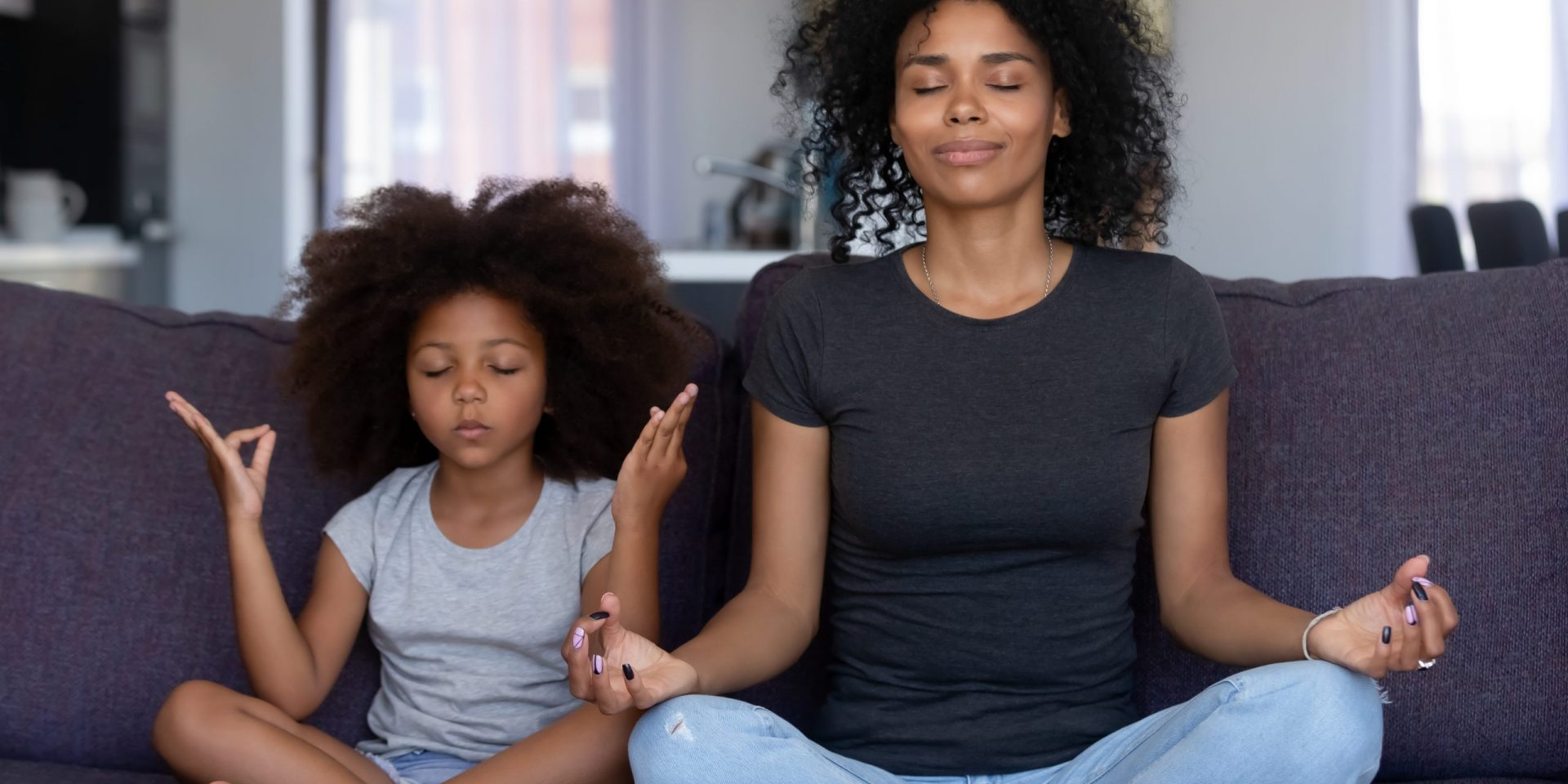 Woman and child meditating