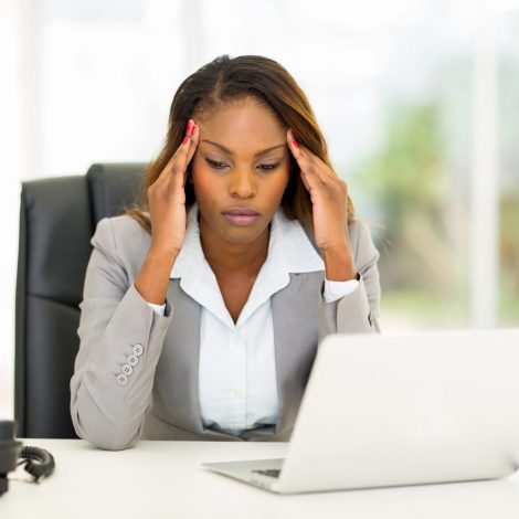 Frustrated business woman on laptop