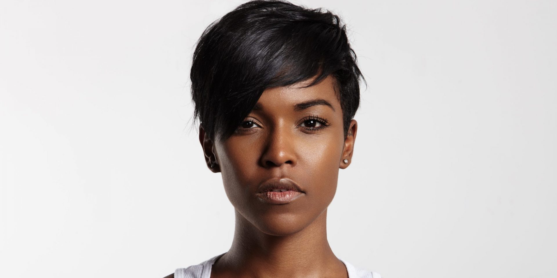 Serious woman with white tank top