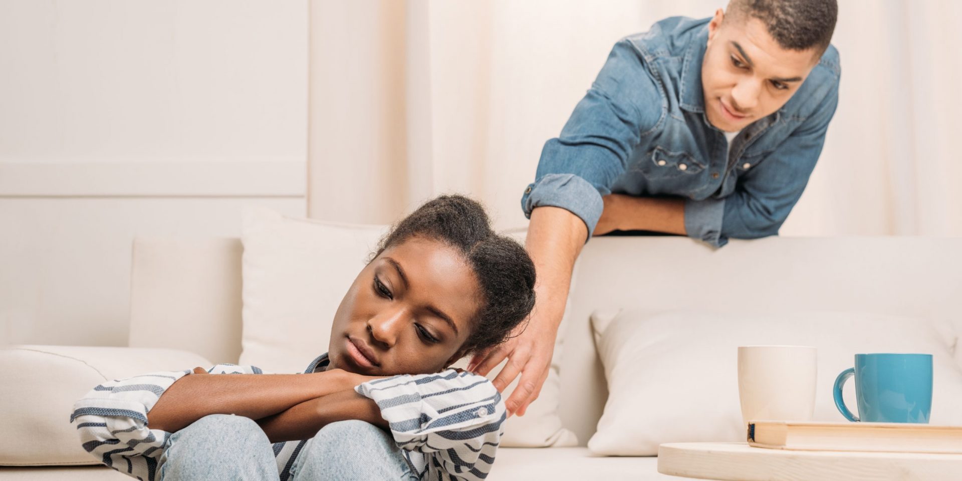 Man reaching for sad/tired woman