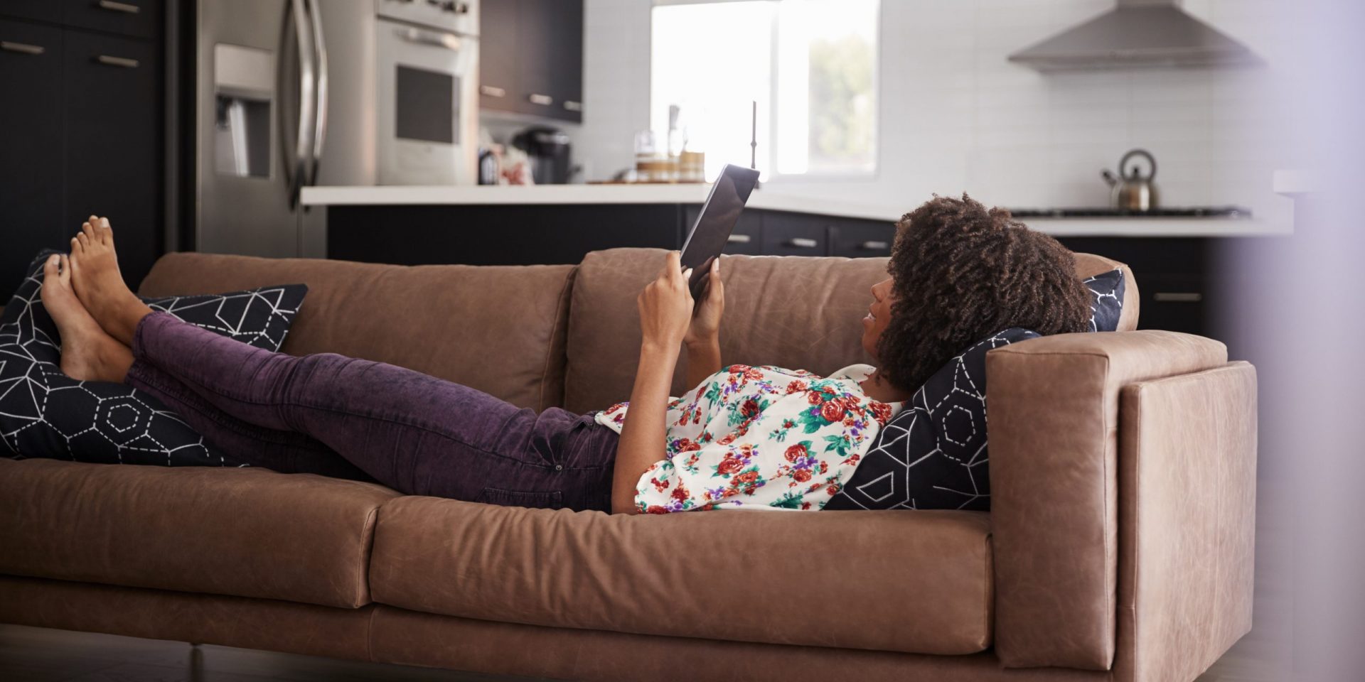 Woman on the couch with her tablet