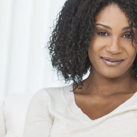 Woman smiling while on the couch