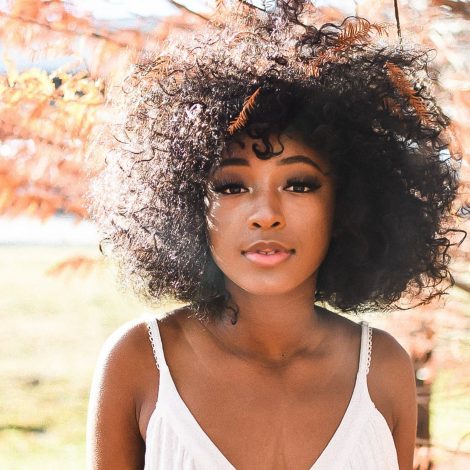 Natural hair photo of woman under a tree