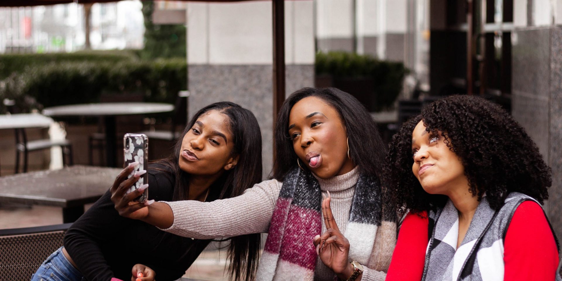 Friends taking selfies