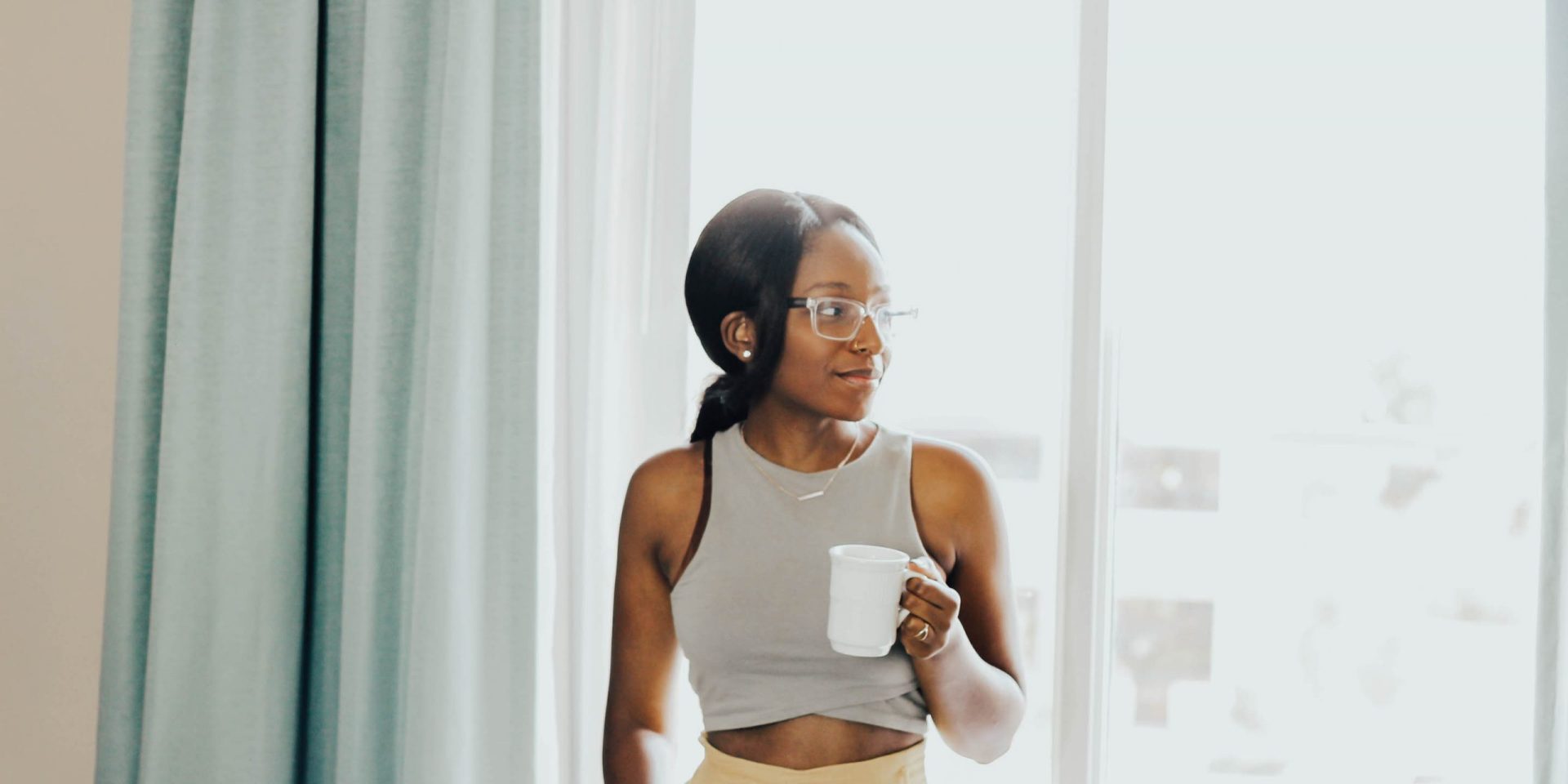 Woman drinking coffee at home