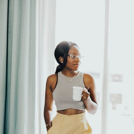 Woman drinking coffee at home