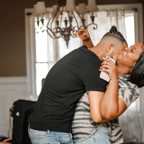 Man hugging woman at home
