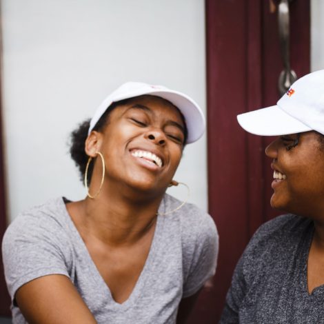 Friends/LGBTQ couple laughing