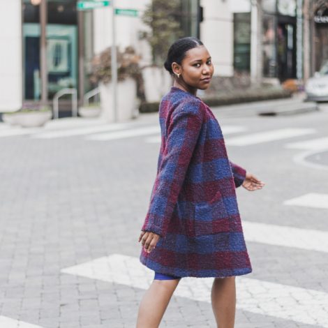 Chic woman walking down crosswalk