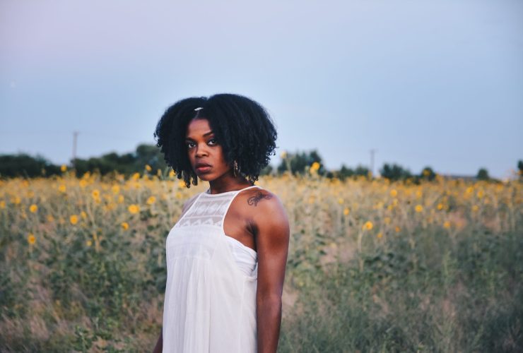 Woman standing in field of flowers