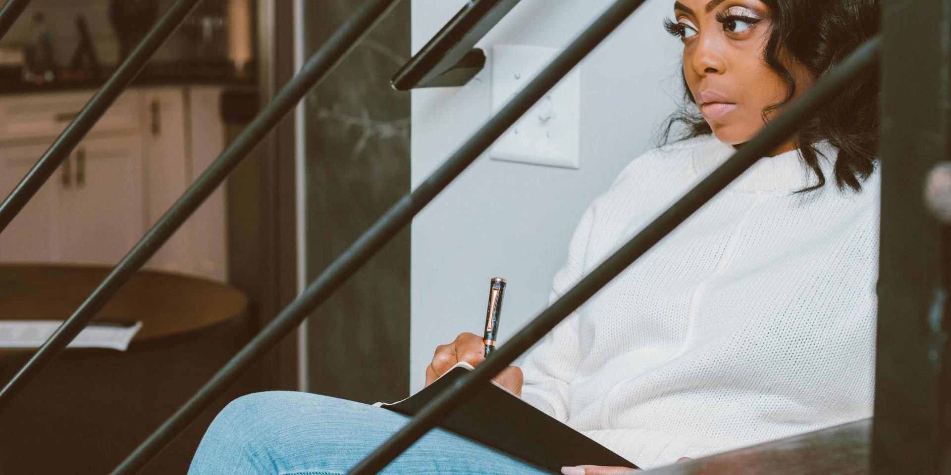 Woman reflecting and journaling