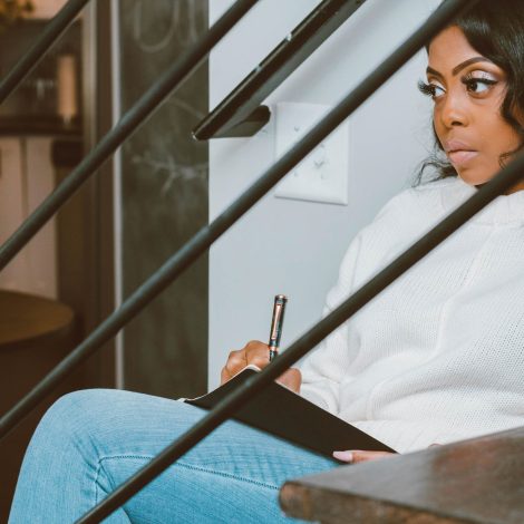 Woman reflecting and journaling